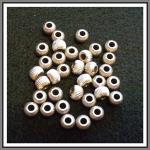Plated Findings: Corrugated Almost Round Nickel 5 x 7mm, 100 pieces.