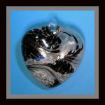Heart:  #7, Dark, dark, dark brown and grey, 4 Inches across, 2 thick at its widest, looped, hollow, 3 for $21