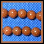 Rounds: Goldstone (Glass) 12mm Rounds Strands 15 - 16 inches