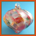 Top: HB99 Irridescent Glass Top, Mostly Orange, about 4 by 4 inches, looped, hollow, 3 for $18