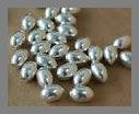 Brass: Nickel Plated Ovals 5 x 7mm, 100 beads