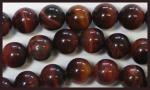 Rounds: Red Tigereye 10mm by the Strand 15 - 16 inches